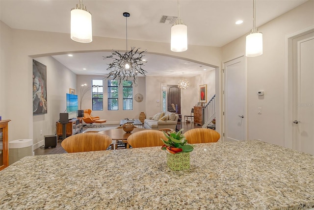 dining space featuring a notable chandelier