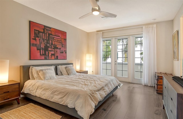 bedroom with wood-type flooring, access to exterior, ceiling fan, and french doors