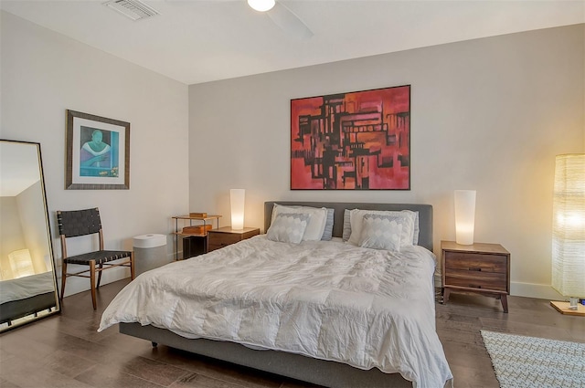 bedroom with ceiling fan and dark hardwood / wood-style flooring