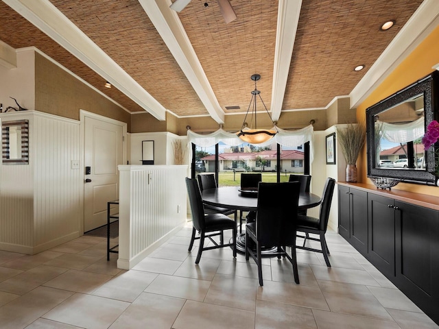 tiled dining room with lofted ceiling with beams