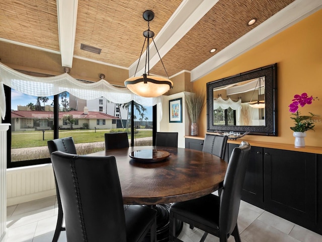 tiled dining area with beamed ceiling