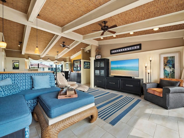 living room featuring ceiling fan, lofted ceiling with beams, and light tile patterned floors