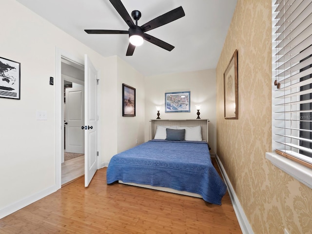 bedroom featuring hardwood / wood-style flooring and ceiling fan