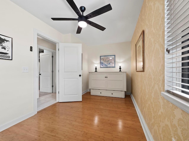 unfurnished bedroom featuring ceiling fan and light hardwood / wood-style flooring