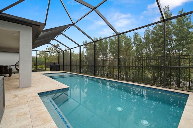 view of pool featuring a lanai and a patio