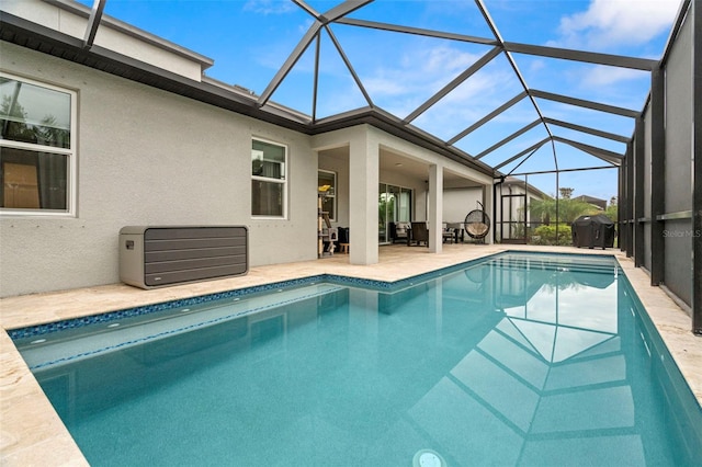 view of pool featuring a patio area and a lanai