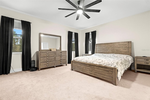 bedroom featuring ceiling fan and carpet