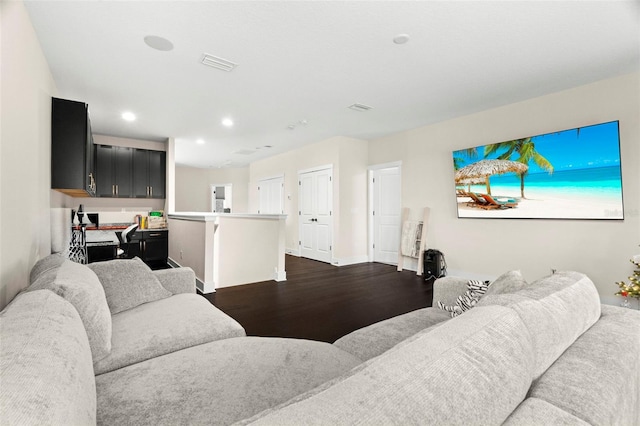 living room with dark hardwood / wood-style flooring