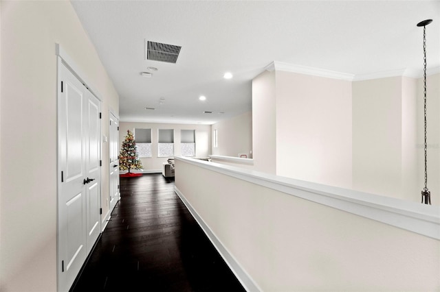 corridor with ornamental molding and dark hardwood / wood-style floors