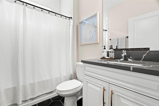 full bathroom featuring shower / bath combo with shower curtain, toilet, tile patterned floors, and vanity