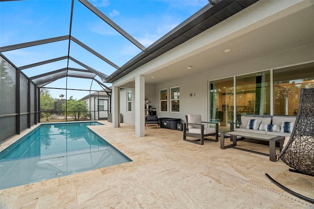 view of swimming pool featuring glass enclosure, a patio, and an outdoor hangout area