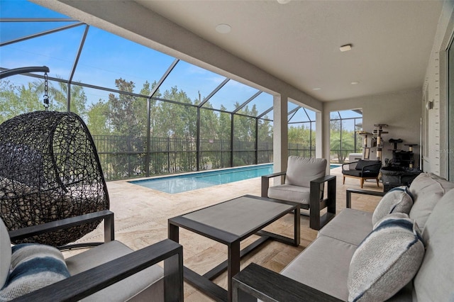 exterior space featuring glass enclosure, outdoor lounge area, and a patio