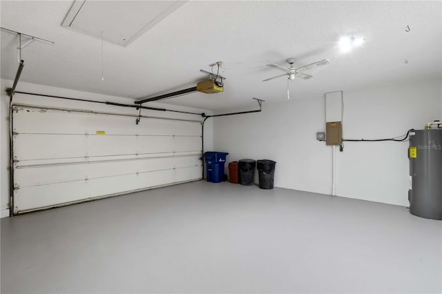 garage with a garage door opener, electric panel, and water heater