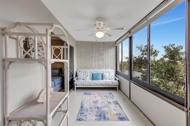 sunroom / solarium featuring ceiling fan