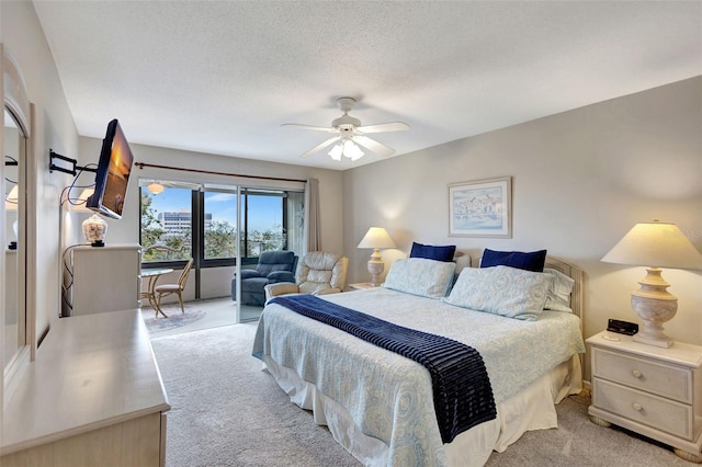 bedroom with light carpet, a textured ceiling, and ceiling fan