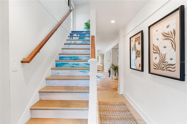 stairway with wood-type flooring