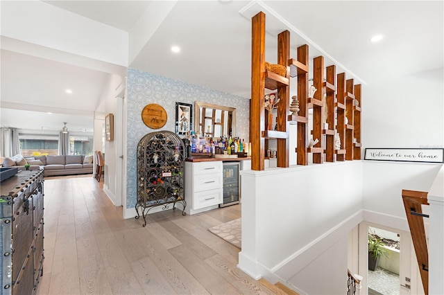 hall featuring beverage cooler and light wood-type flooring