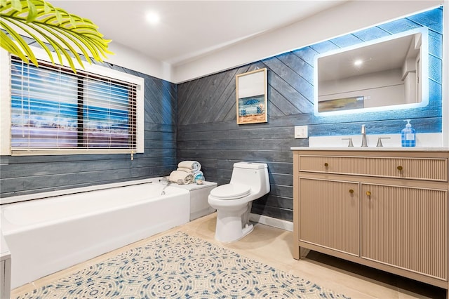 bathroom featuring vanity, a washtub, tile patterned flooring, and toilet