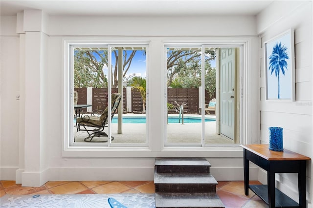 doorway to outside featuring light tile patterned floors