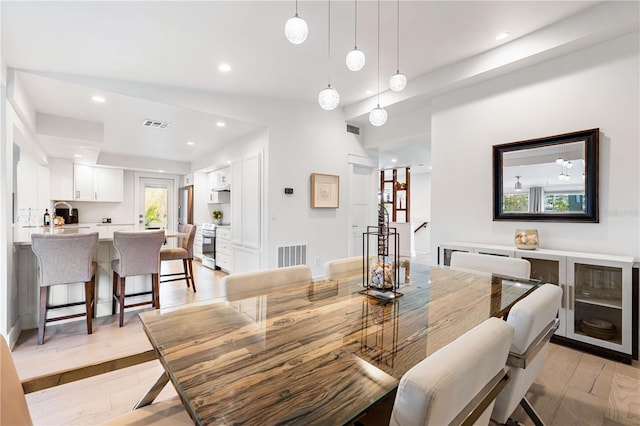 dining space featuring light hardwood / wood-style floors