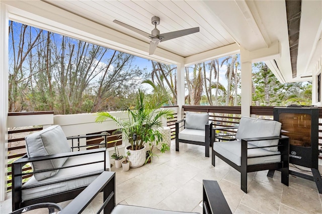 sunroom / solarium with ceiling fan