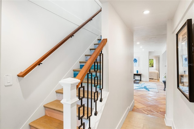 stairway featuring hardwood / wood-style floors