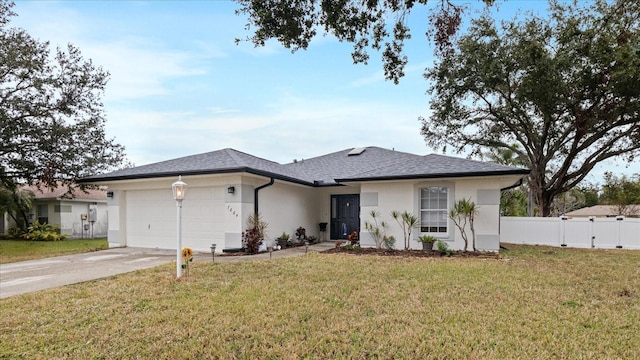 ranch-style house with a garage and a front lawn