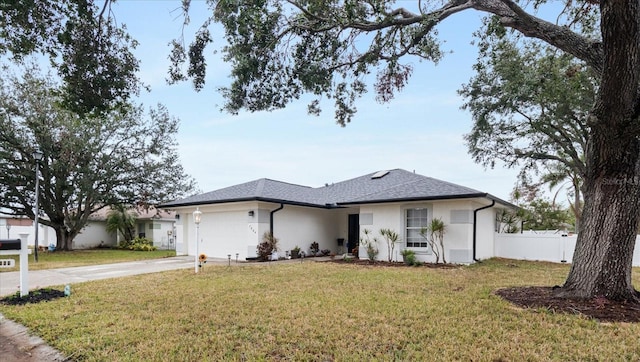 ranch-style home with a front yard and a garage