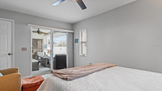 bedroom featuring ceiling fan and access to exterior