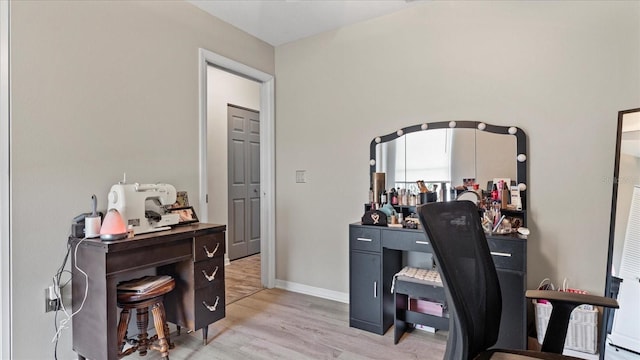 office with light hardwood / wood-style flooring