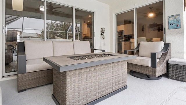 view of patio / terrace featuring an outdoor living space with a fire pit