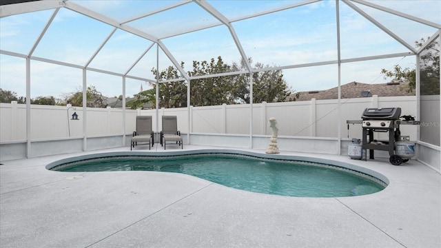 view of pool featuring a patio, a lanai, and a grill