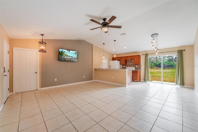 unfurnished living room featuring ceiling fan, light tile patterned floors, and lofted ceiling