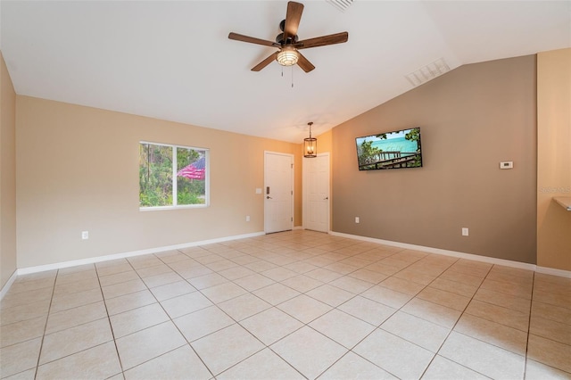 tiled spare room with ceiling fan and lofted ceiling