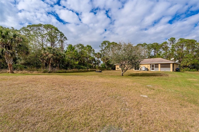 view of yard with a garage