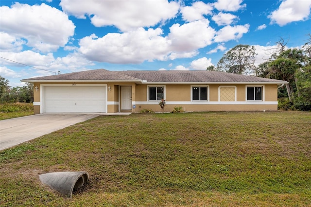 ranch-style home with a garage and a front lawn