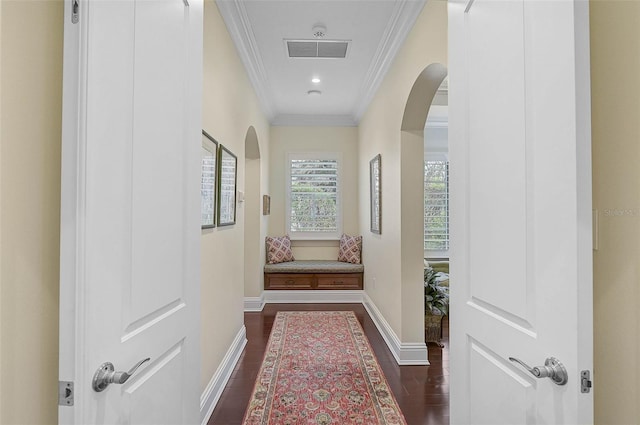 corridor featuring crown molding and dark wood-type flooring