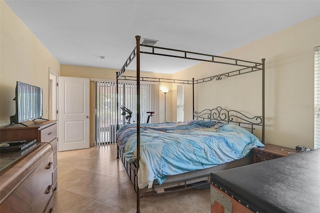 bedroom featuring light tile patterned floors