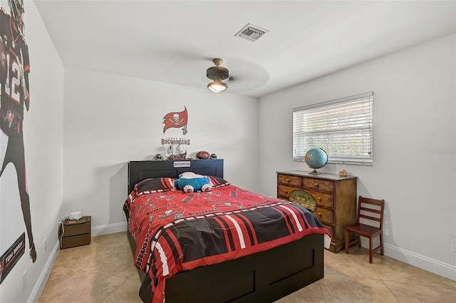 bedroom with tile patterned flooring and ceiling fan