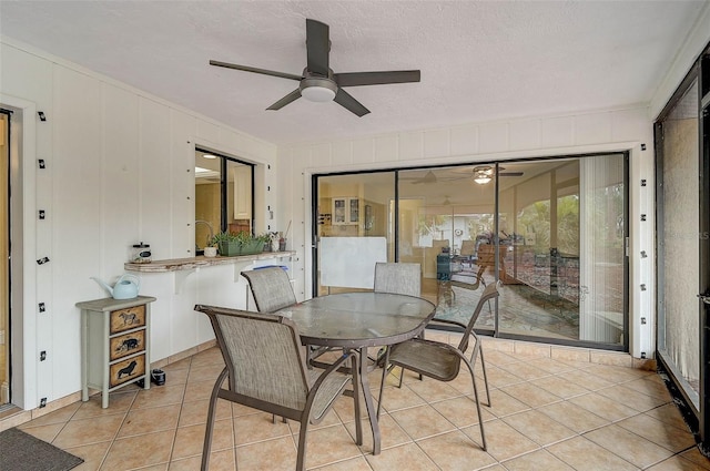 sunroom / solarium with ceiling fan