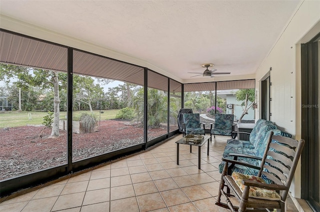 sunroom with ceiling fan and a wealth of natural light