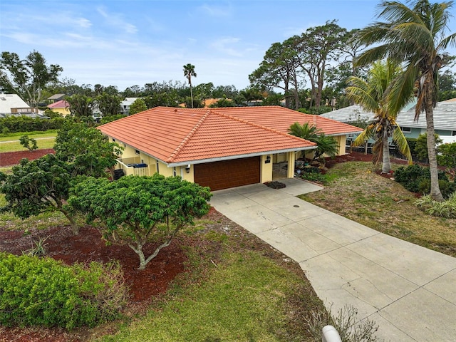 view of front of house with a garage and a front lawn