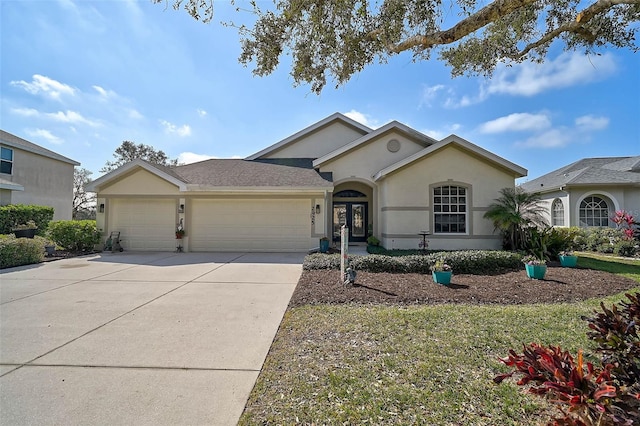 ranch-style home with a garage and french doors