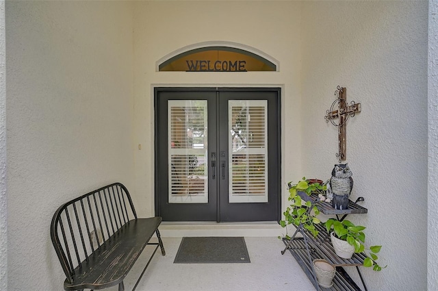 view of exterior entry featuring french doors