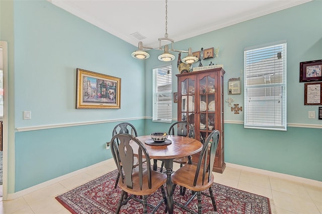 tiled dining area with crown molding