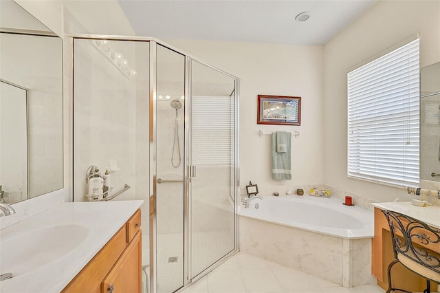 bathroom featuring vanity, tile patterned flooring, shower with separate bathtub, and a healthy amount of sunlight