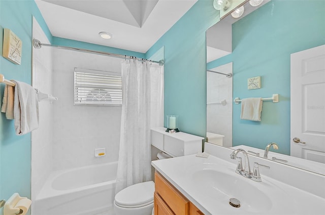 full bathroom featuring vanity, shower / bathtub combination with curtain, and toilet