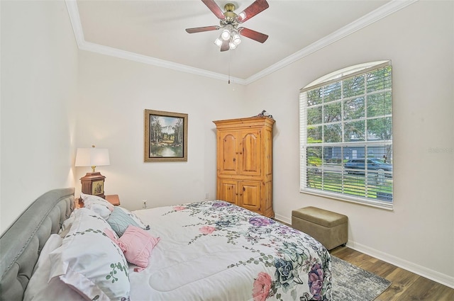 bedroom featuring ornamental molding, dark hardwood / wood-style floors, and ceiling fan