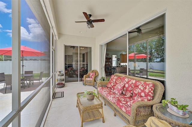 sunroom / solarium with ceiling fan