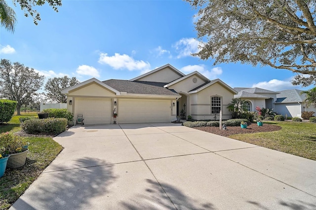 ranch-style home with a garage and a front lawn